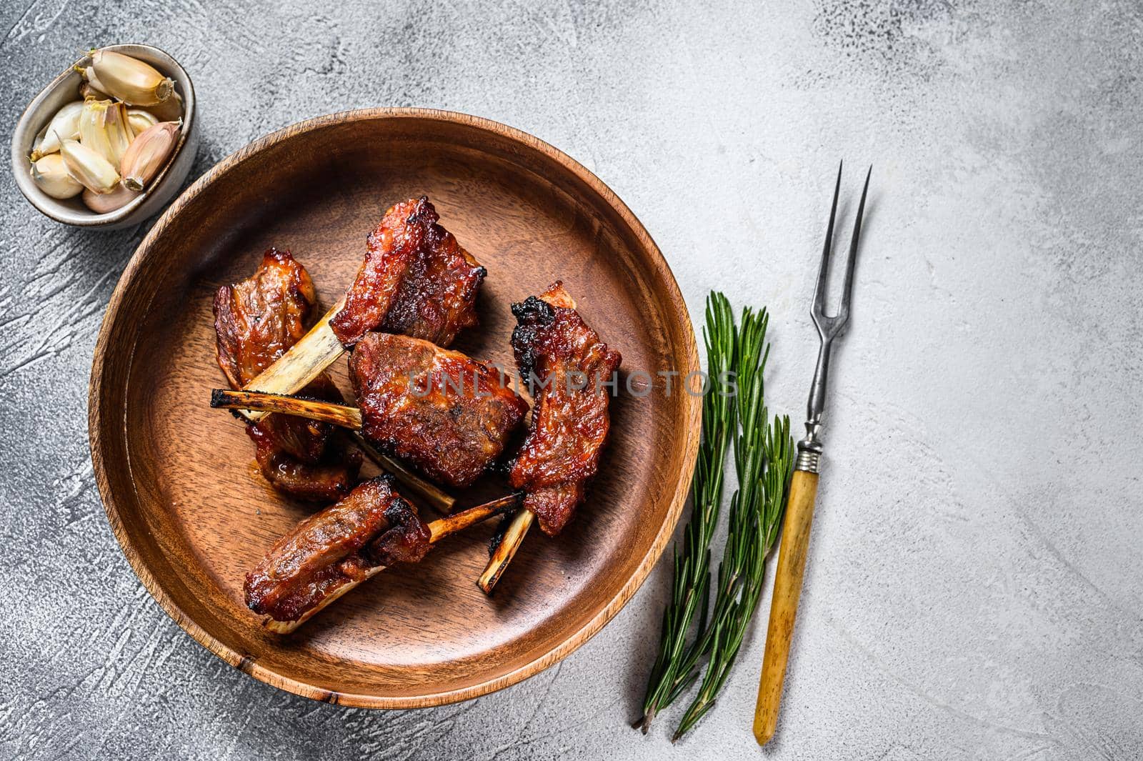 BBQ grilled sliced lamb short spare loin ribs. White background. Top view. Copy space by Composter