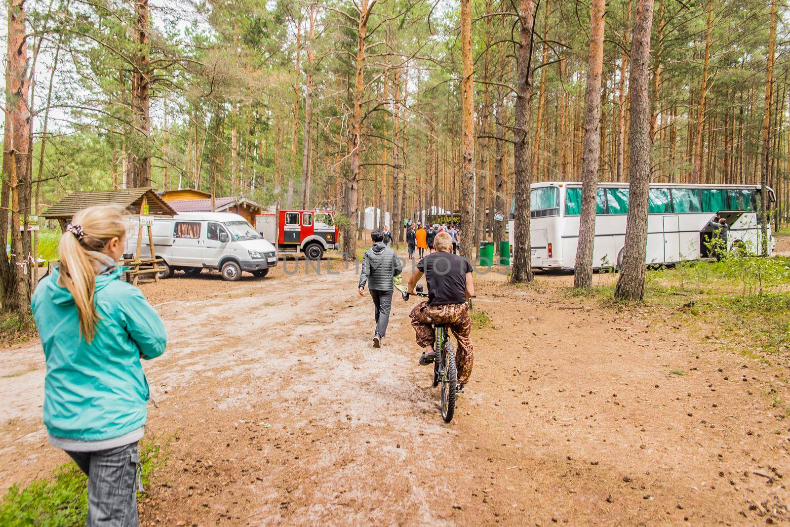 Belarus, Minsk Region - June 29, 2019: Camp in the forest with tourists outdoor, travel and leisure, camping lifestyle by AYDO8