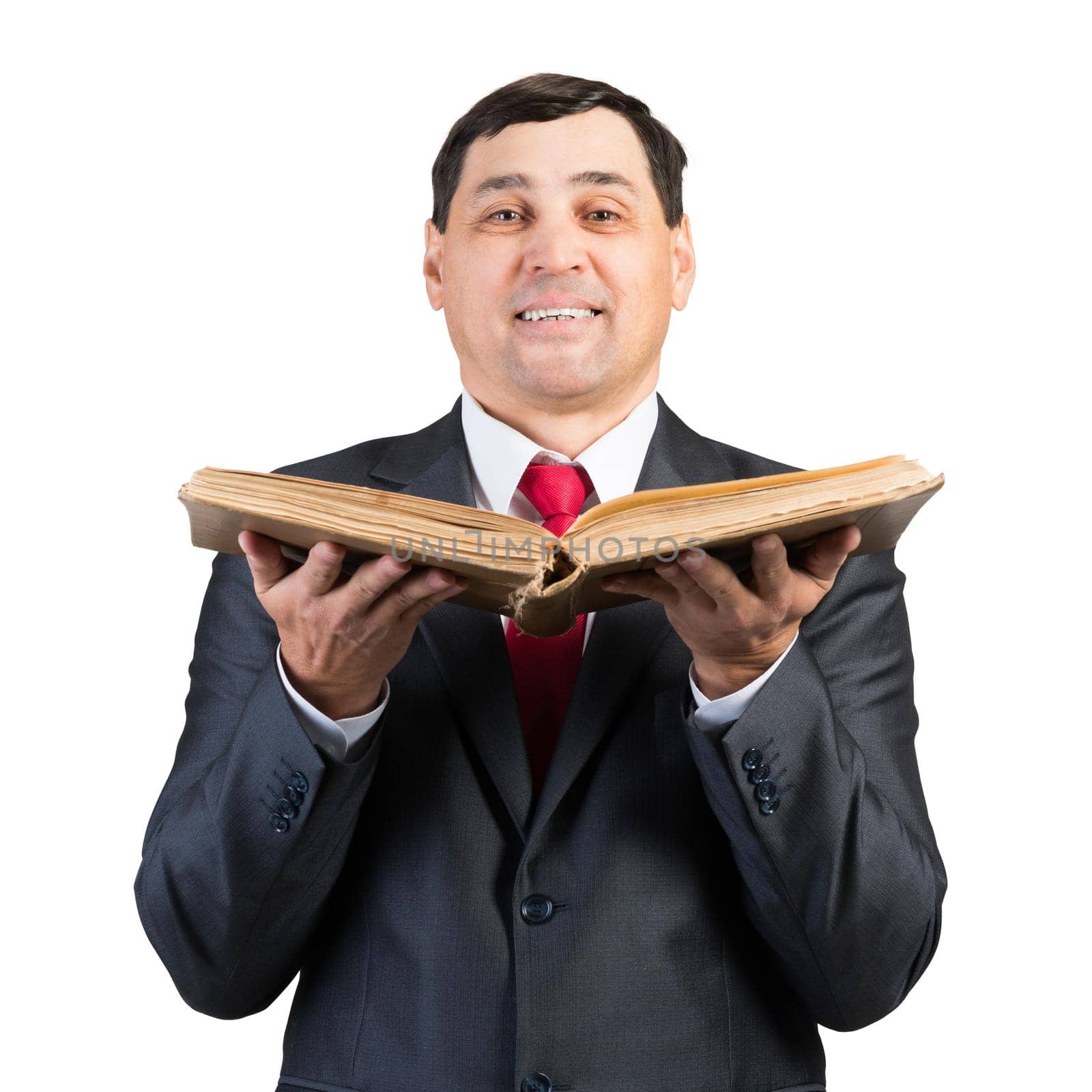 Senior businessman holding book and looking at camera. Portrait of smiling adult man in business suit and tie standing on white background. Education and knowledges. Professional business accounting.