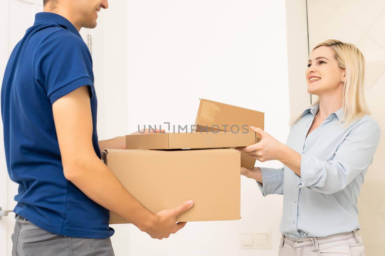 Delivery man holding cardboard boxes. Fast and free Delivery transport . Online shopping and Express delivery . Quarantine