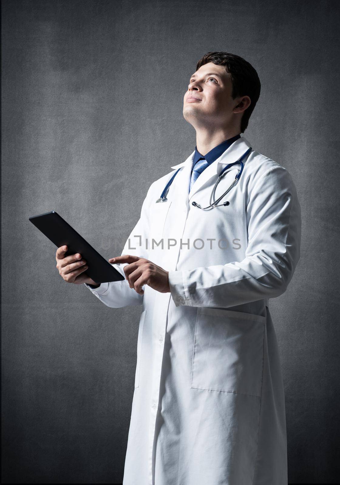 The doctor with the computer tablet. Digital technology in healthcare