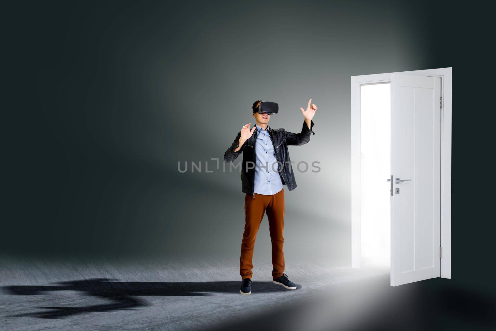 businessman wearing virtual glasses standing in front of opened doors.