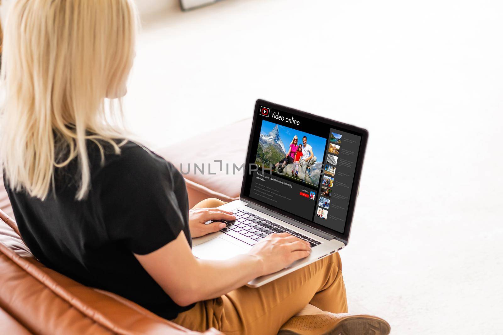 Happy woman planning vacations on line searching information in a laptop in a resort or hotel