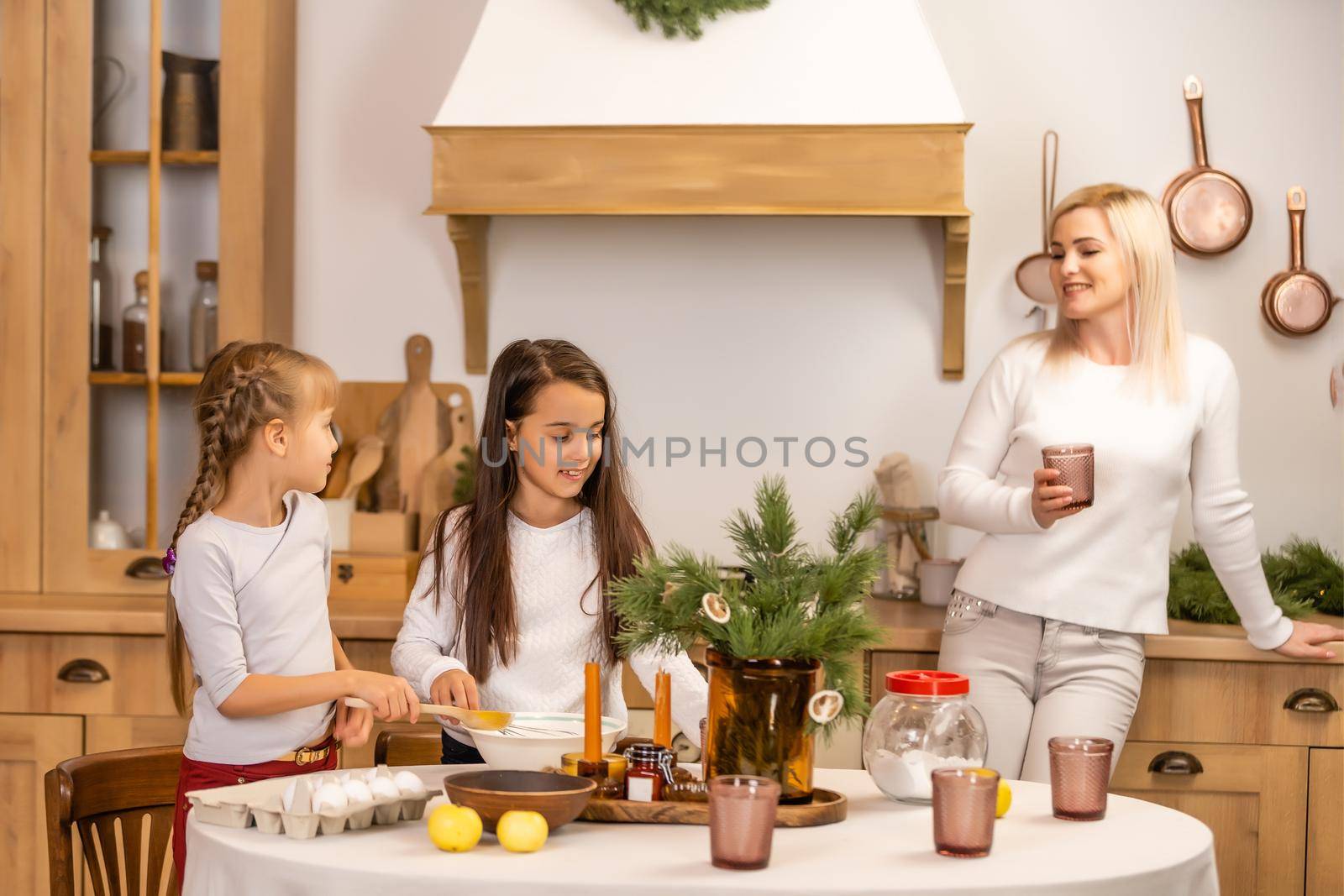Happy family having fun at home, family cooking before christmas by Andelov13