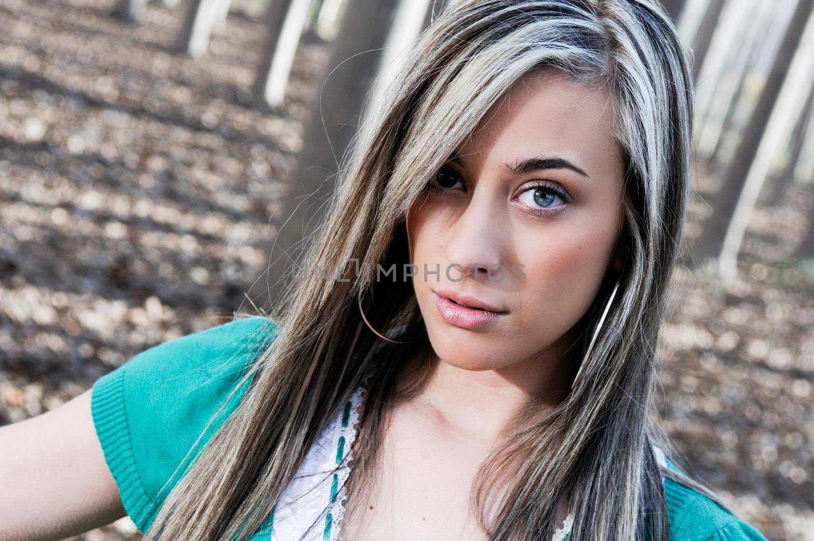 Beautiful blonde girl, dressed in green, into the woods in Fuente Vaqueros, Granada, Andalusia, Spain