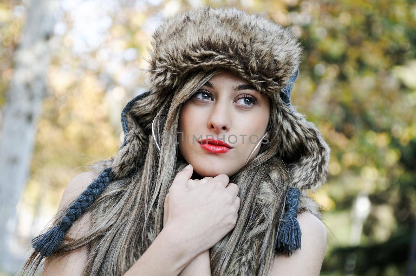 Portrait of beautiful girl with the winter hat on by javiindy