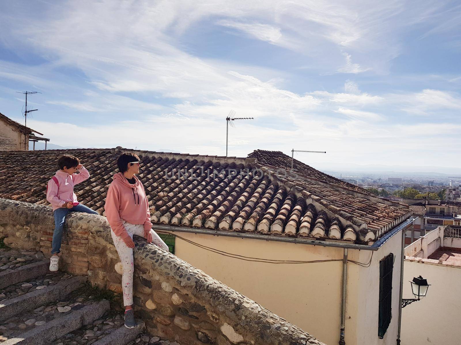 Mother and daughter enjoying the views of Granada from the Realejo neighborhood. by javiindy