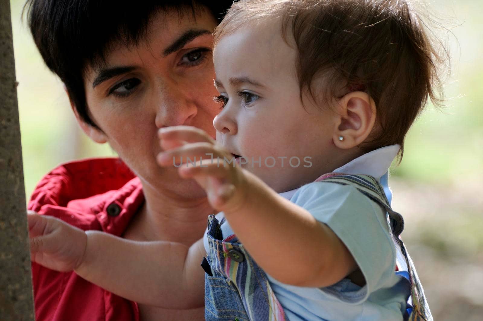 Mother and her little daughter enjoyoing a forest