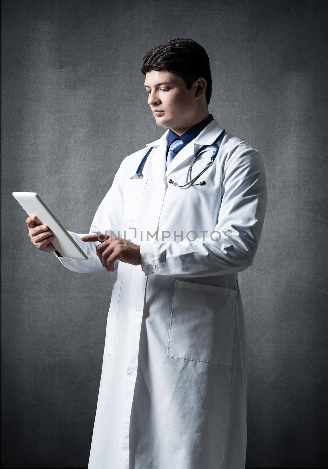 Doctor with a computer tablet by adam121