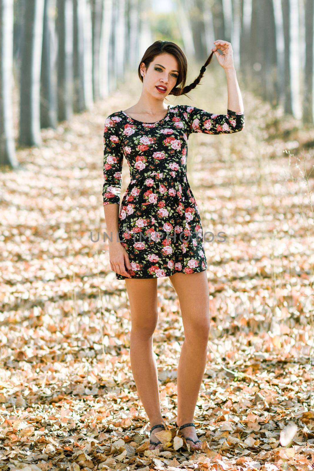 Portrait of pretty girl with green eyes wearing casual clothes in an autumn field