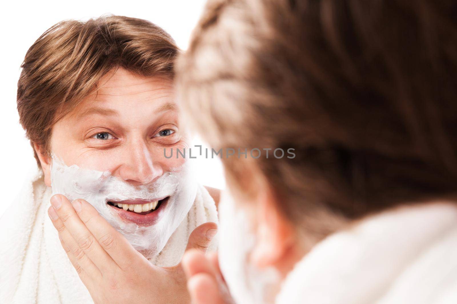Close up of male shaving isolated over white background