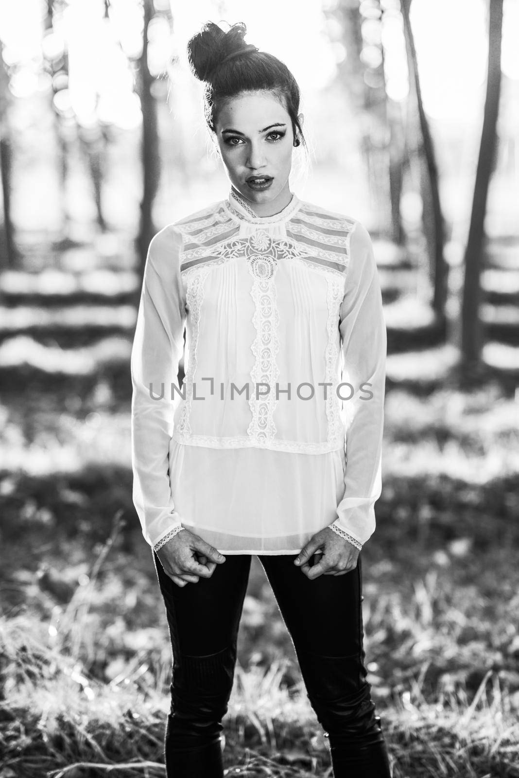 Portrait of pretty girl with green eyes wearing casual clothes in an autumn field