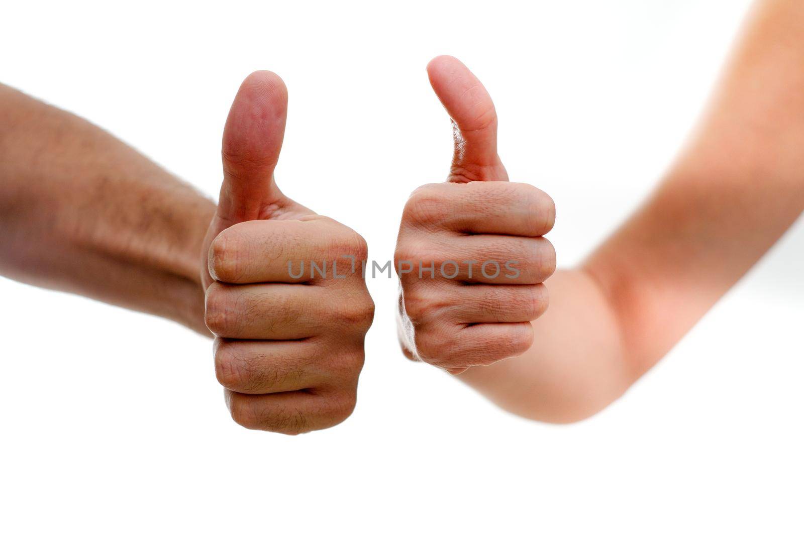 Man and woman hands showing thumbs up sign isolated on white by javiindy