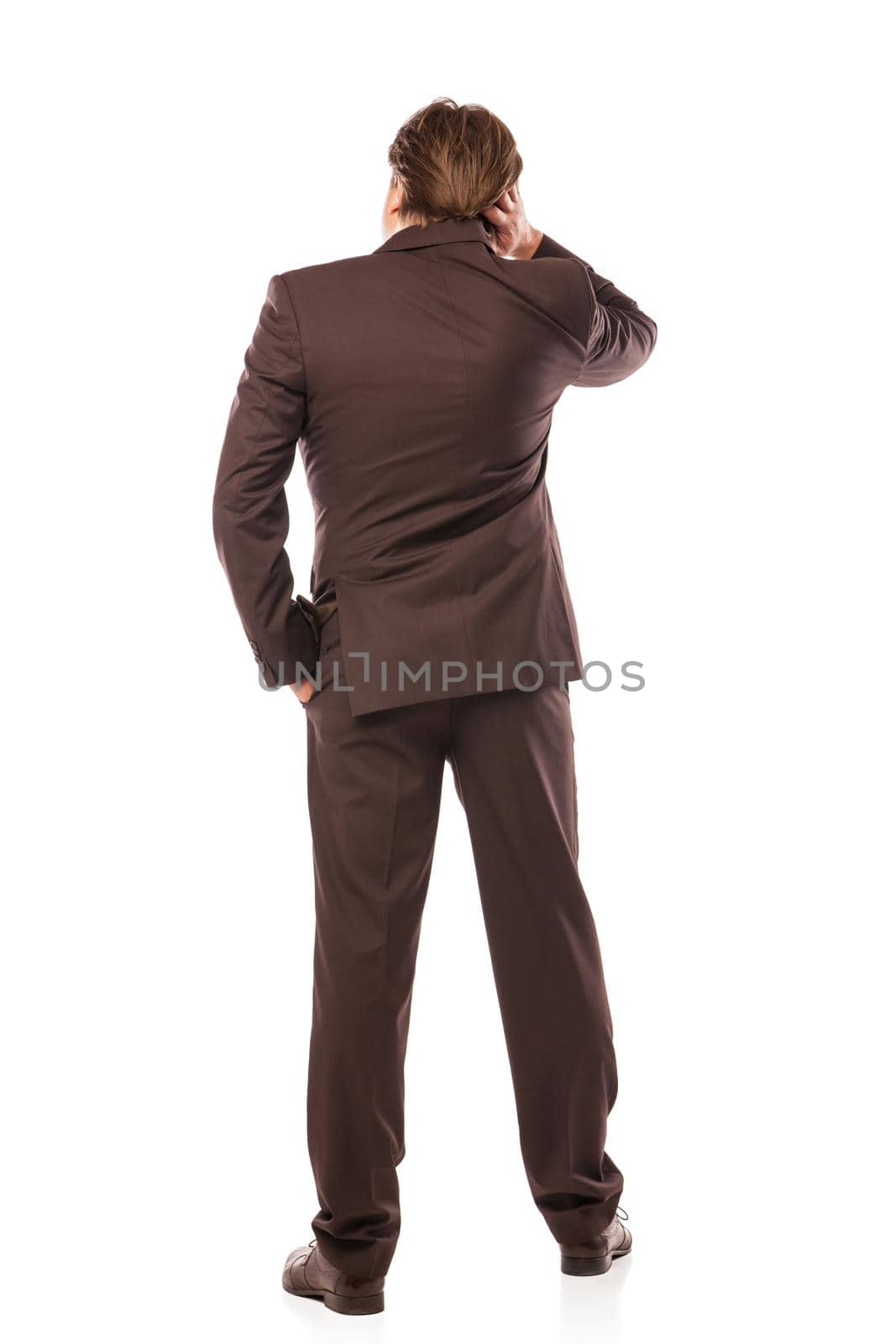 business man from the back looking at something isolated over white background