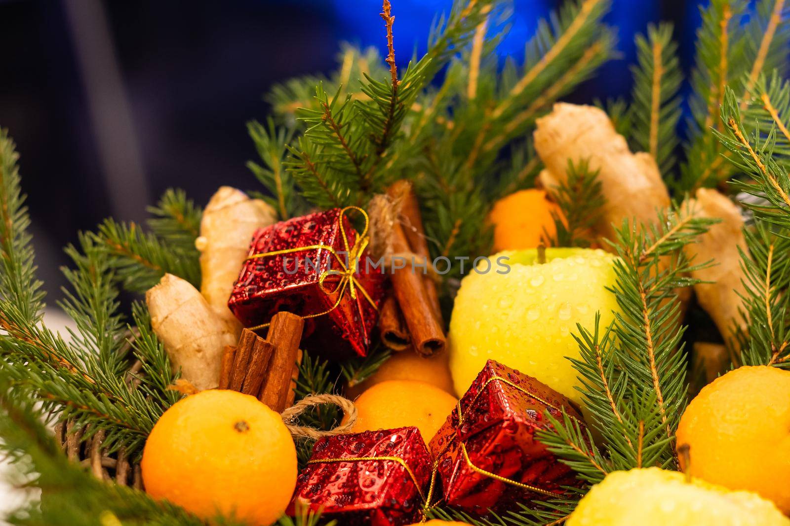 Christmas background with fir tree and tangerines.