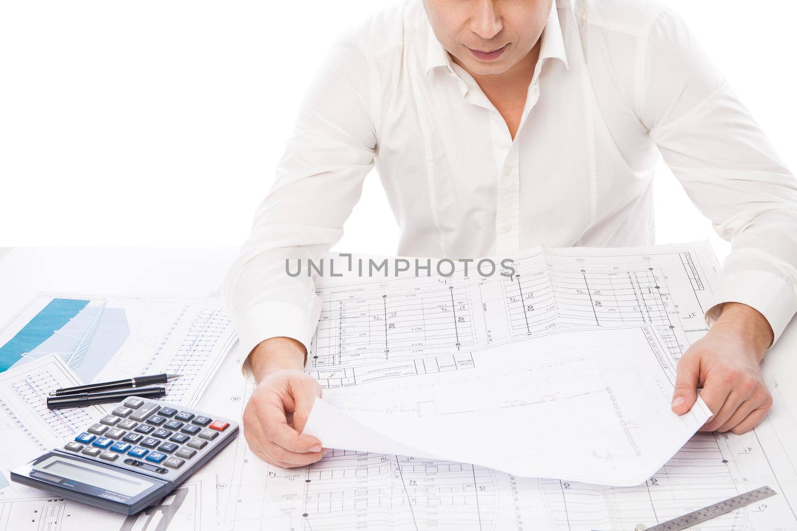 Close-up of Male Architect hand holding Blueprint over white