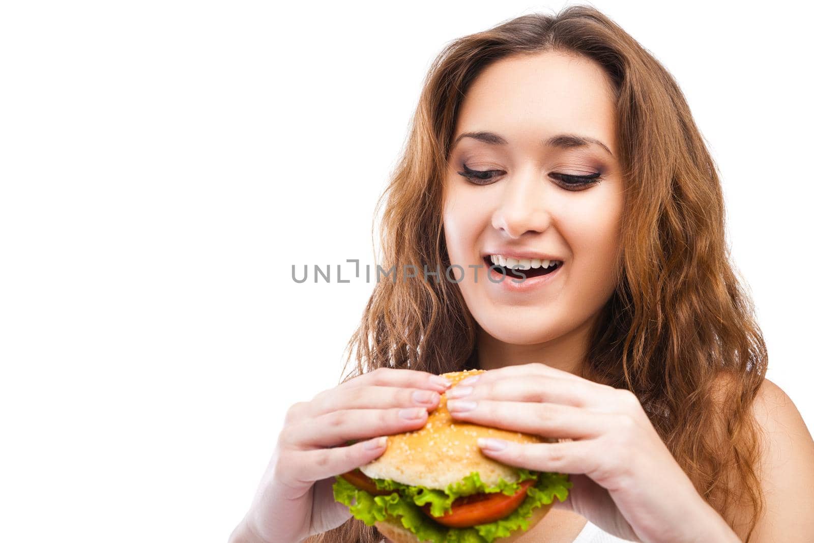 Happy Young Woman Eating big yummy Burger isolated on white background