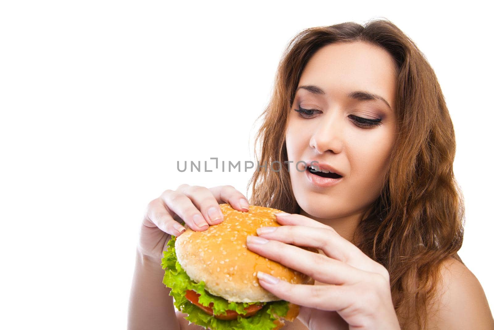 Happy Young Woman Eating big yummy Burger isolated on white background