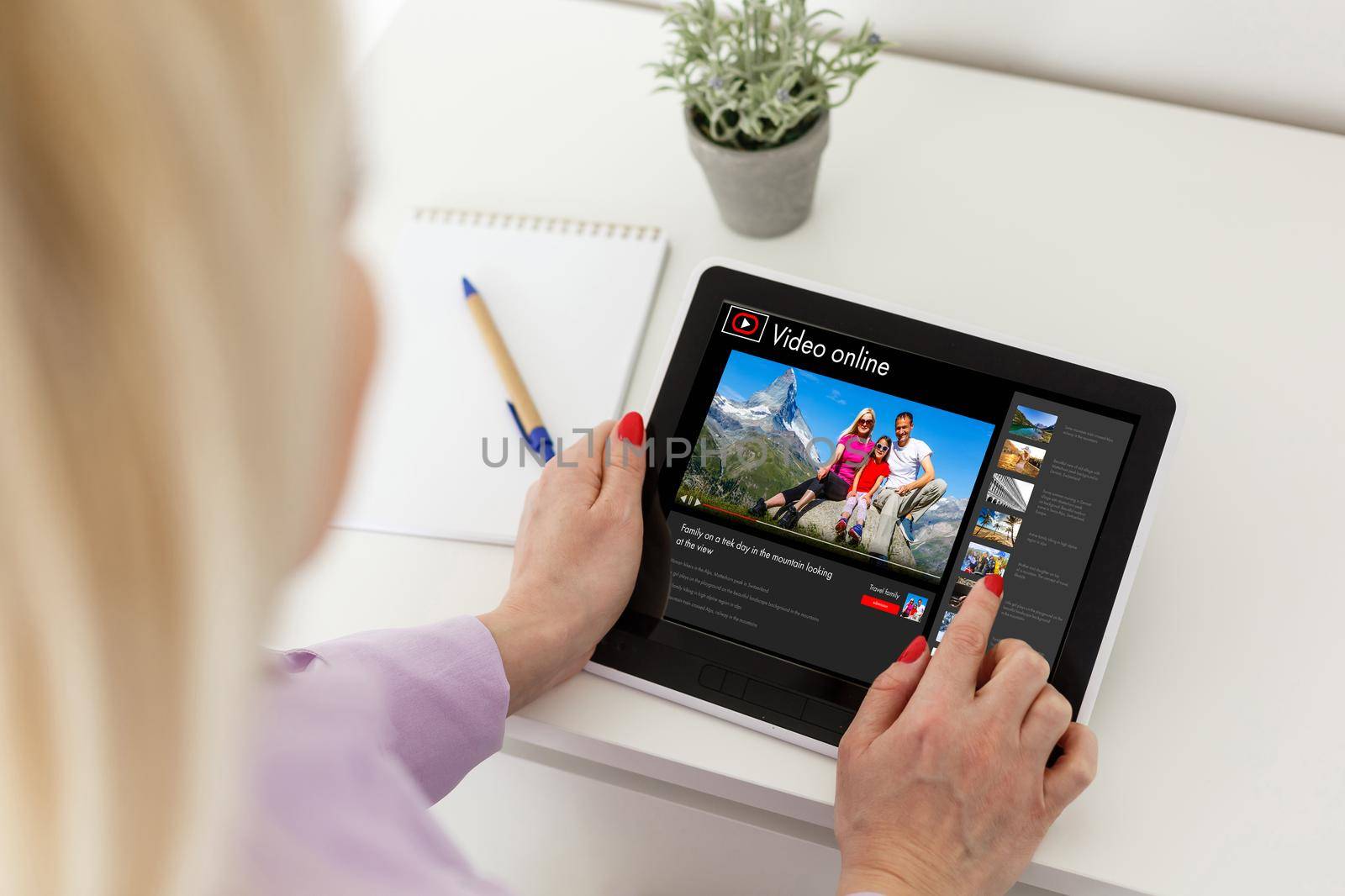 Happy woman planning vacations on line searching information in a laptop in a resort or hotel