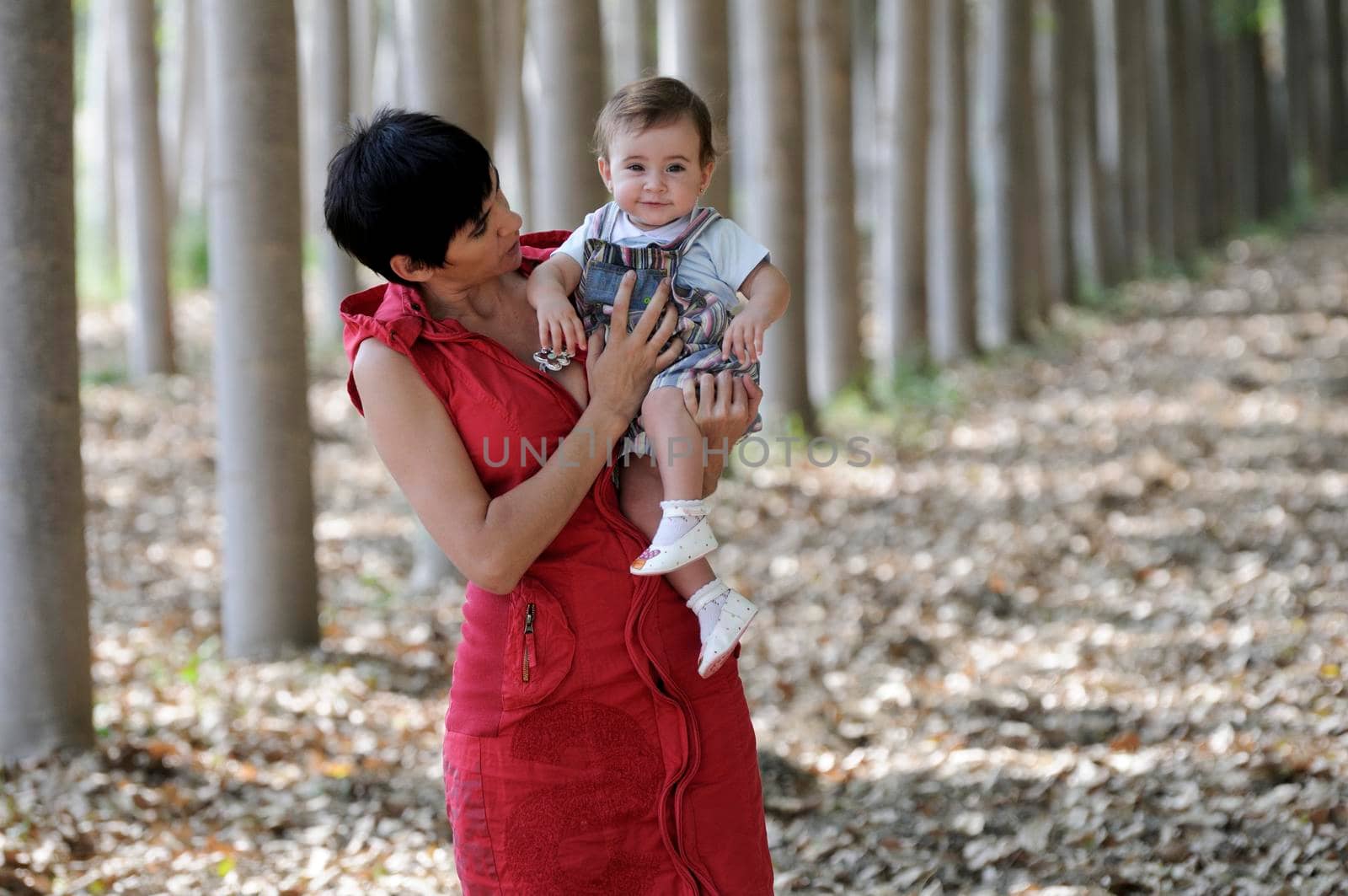 Mother and her little daughter enjoyoing a forest