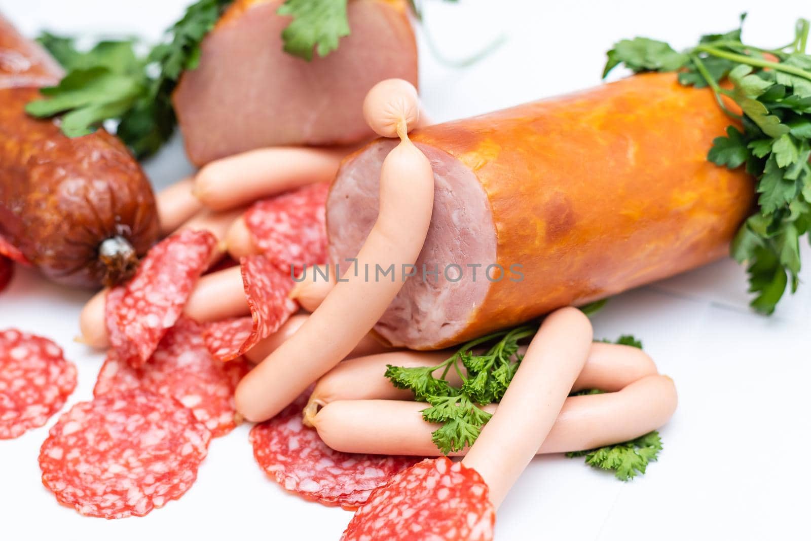 Meat and sausages. Isolated on white.