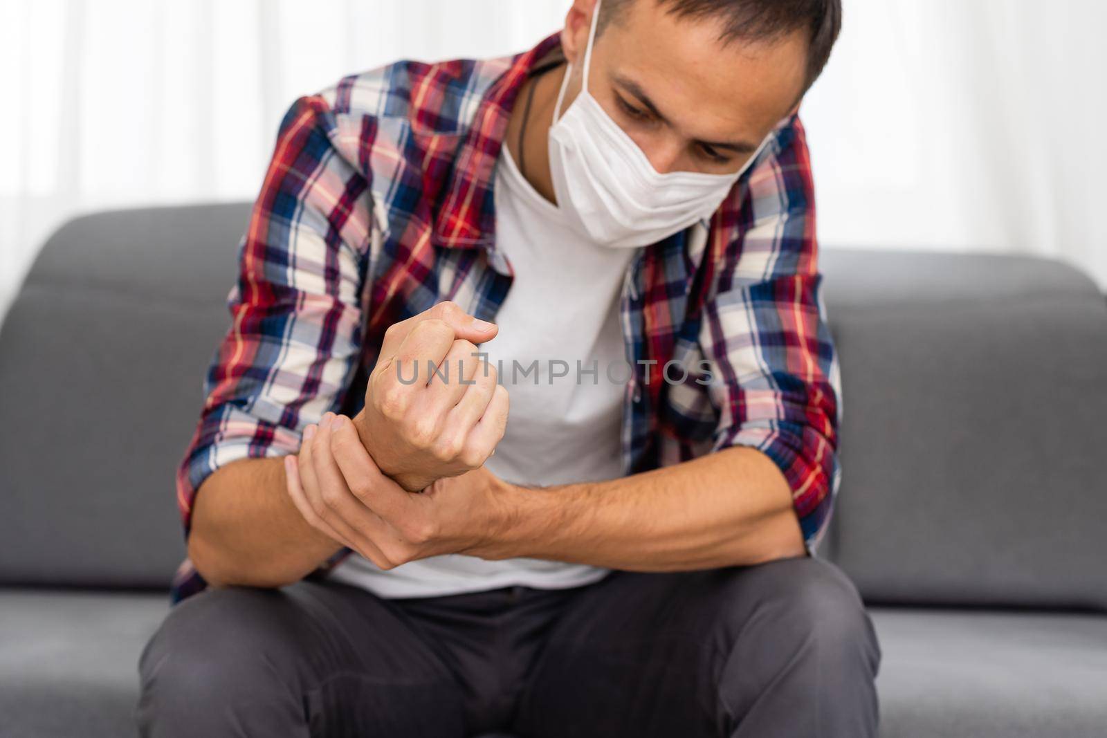 Caucasian handsome man wear masks and hold hand on his chest. background - copy space.