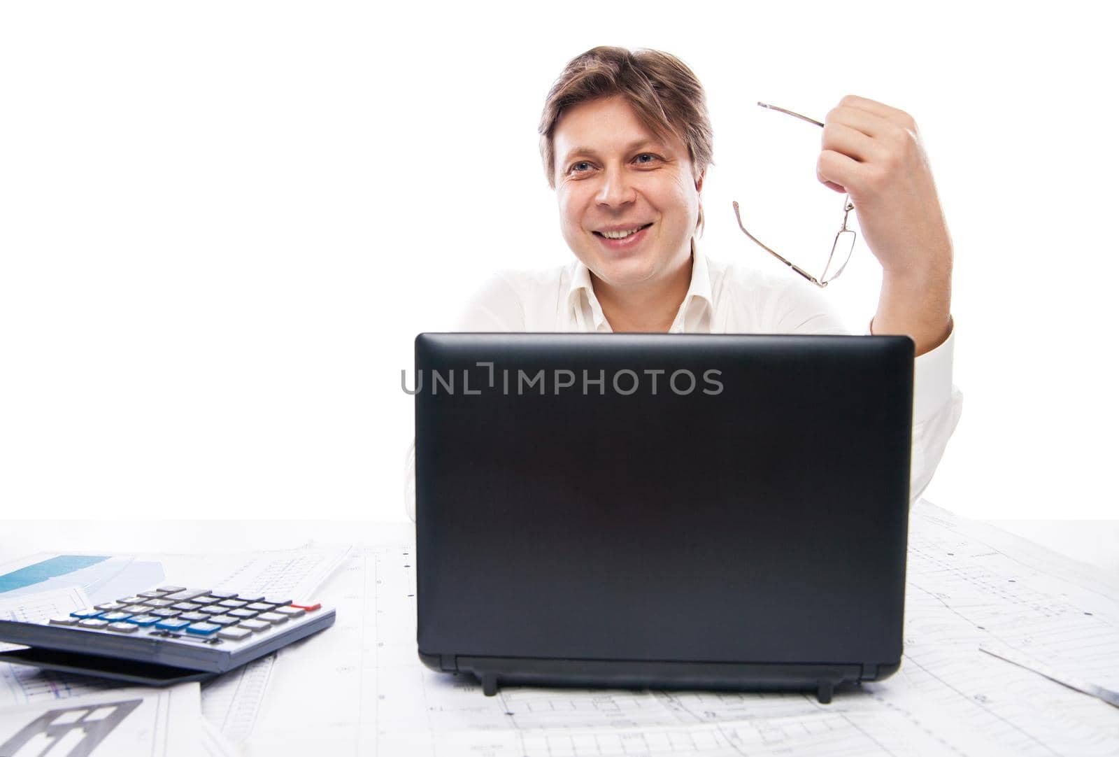 Smiling young office worker with laptop isolated by Julenochek