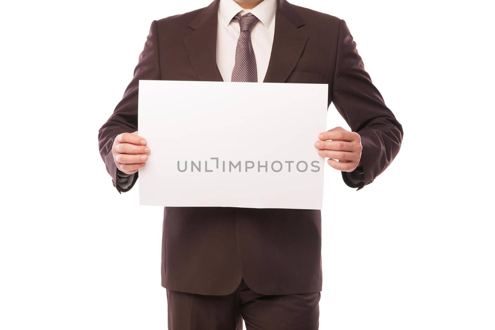 Businessman holding a white piece of paper with empty space for advertisement or information