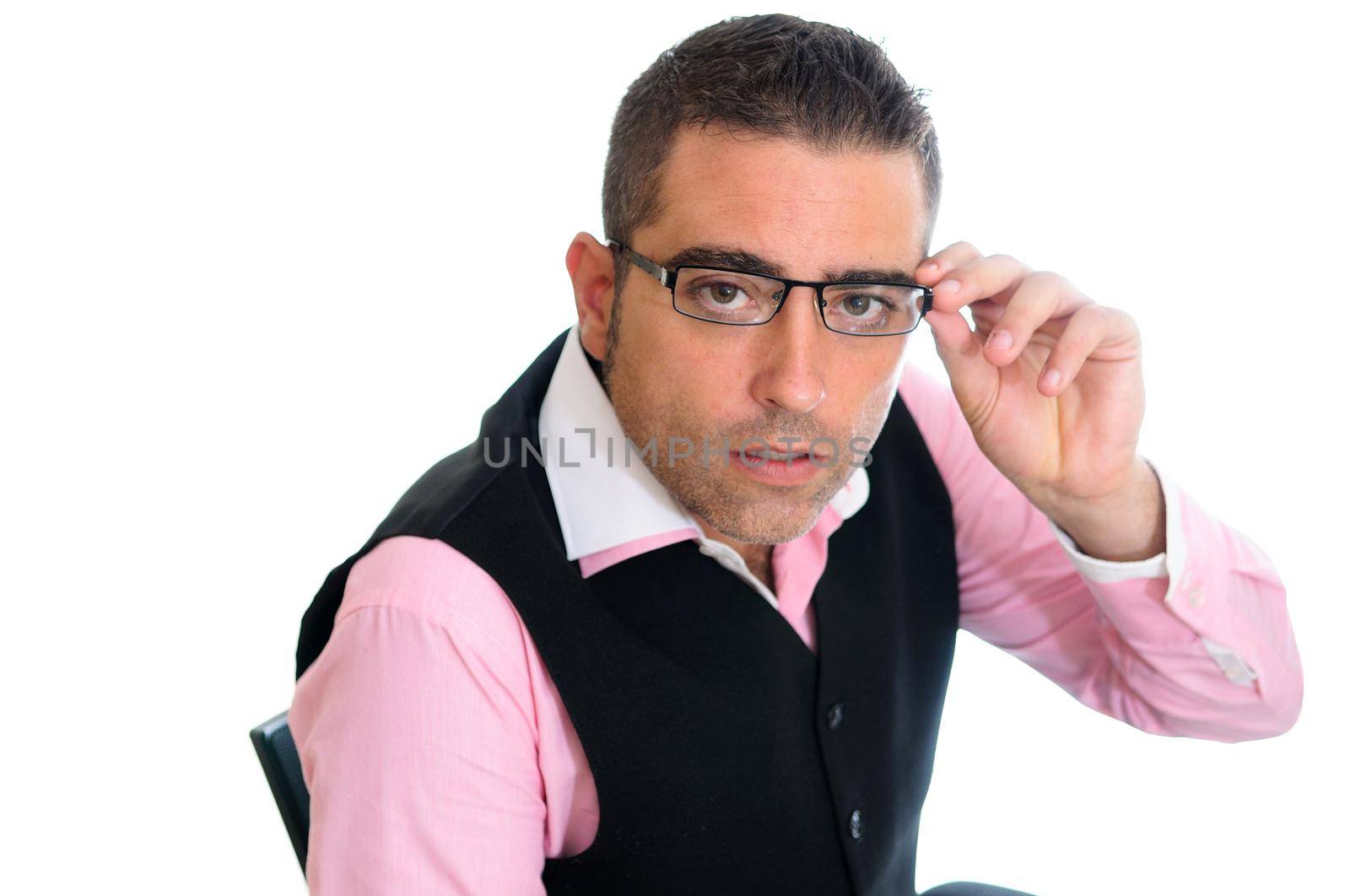 A successful businessman with glasses wearing vest and pink shirt