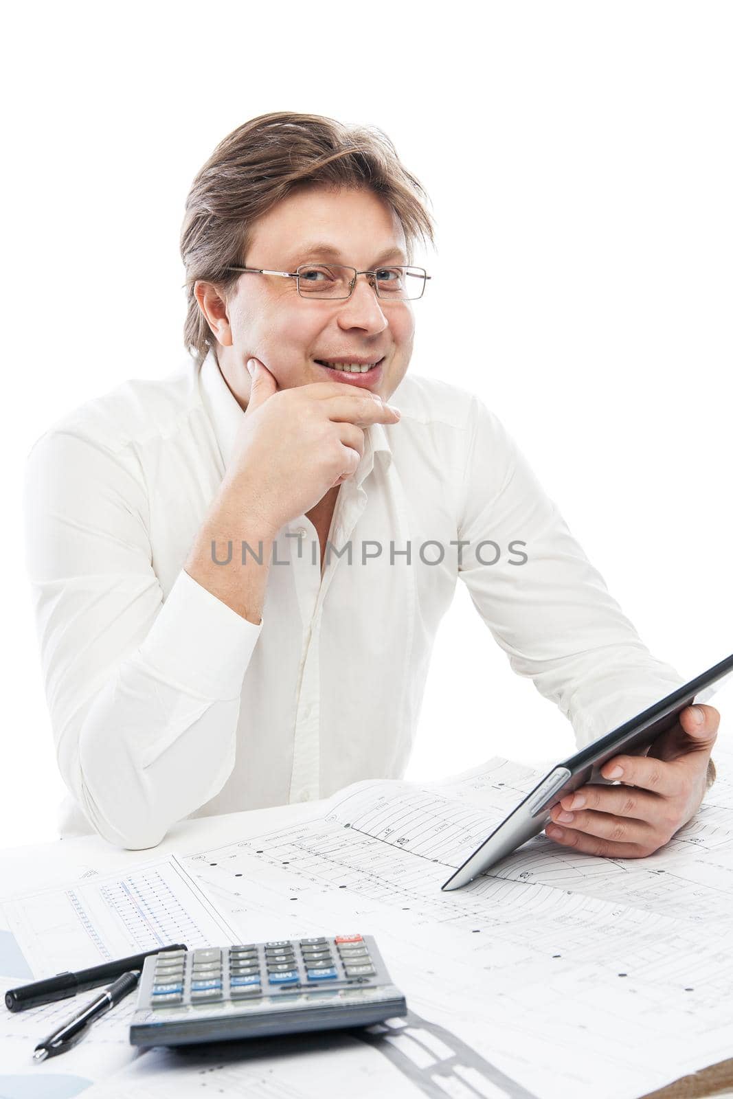 Businessman using tablet PC in office isolated over white. Draft on table