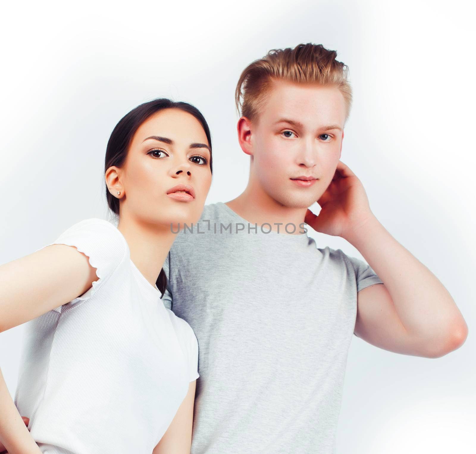 modern hipster guys together couple diverse nations, asian girl and caucasian blond boy isolated on white background, lifestyle people concept close up