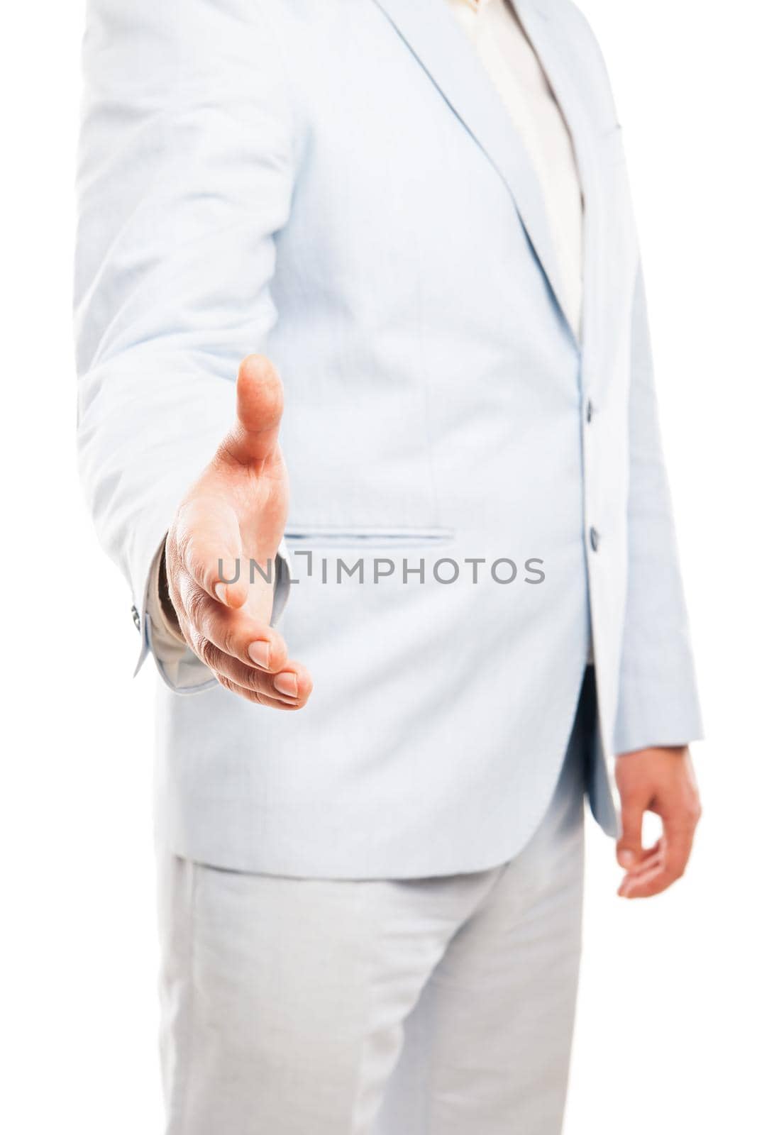 Close up of businessman wearing light suit extended his hand to handshake isolated on white background