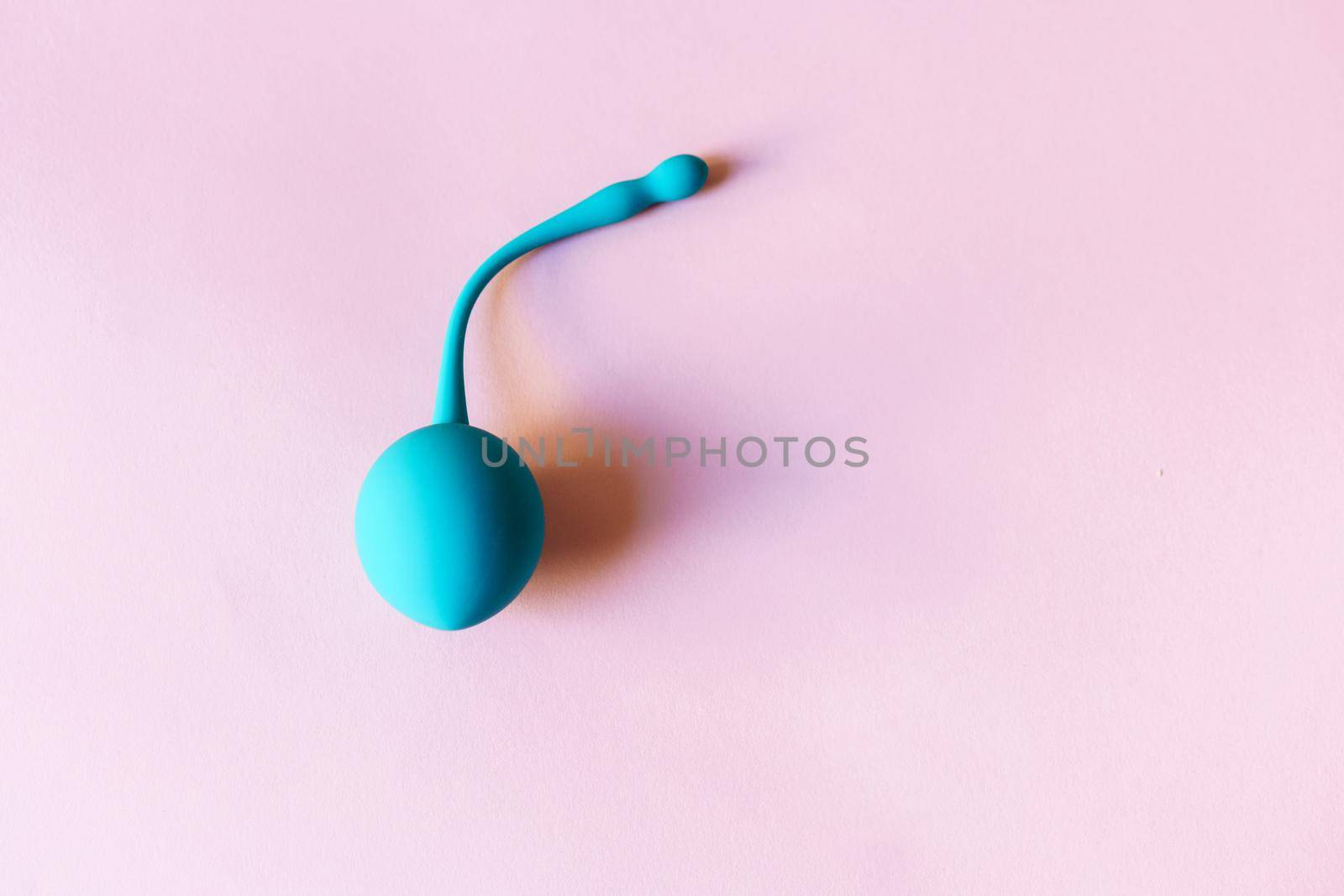 Blue Kegel ball, Geisha ball in pink background.