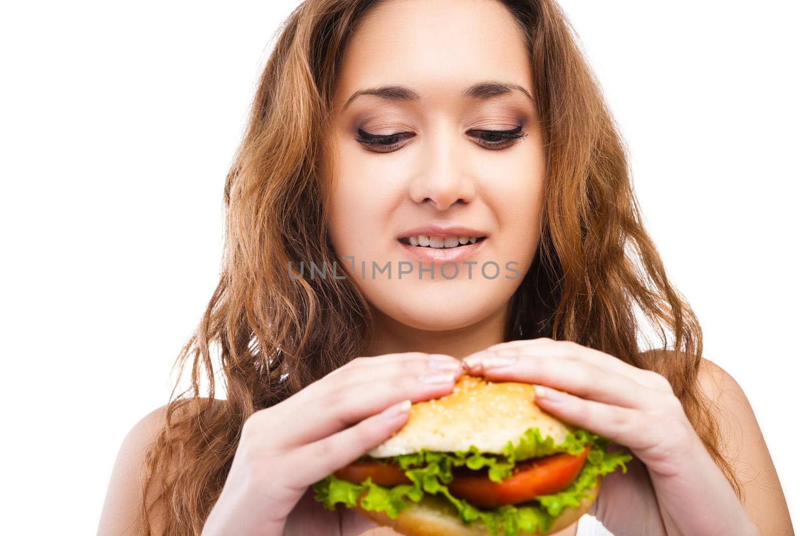 Happy Young Woman Eating big yummy Burger isolated on white background