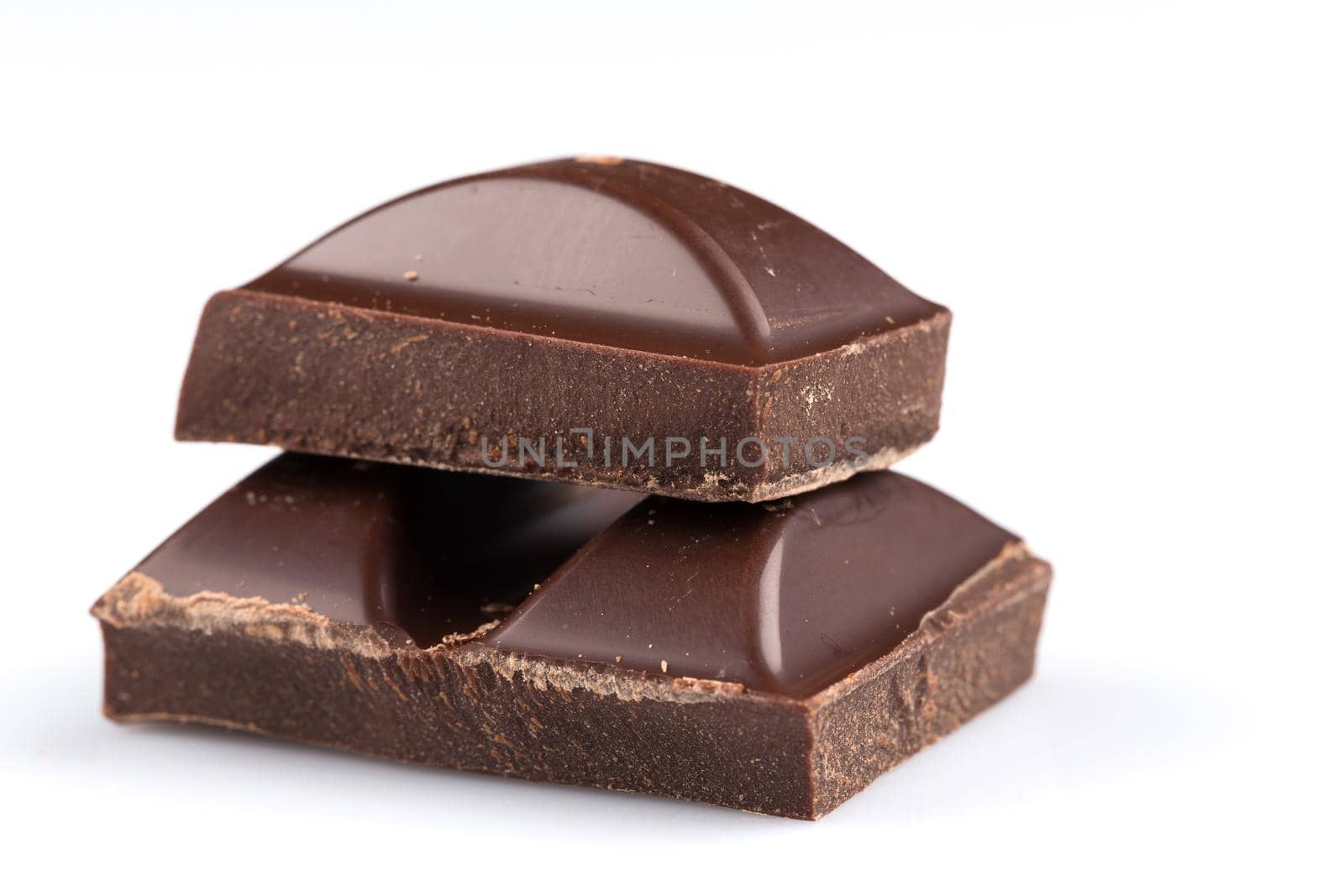 Dark chocolate bars on a white background