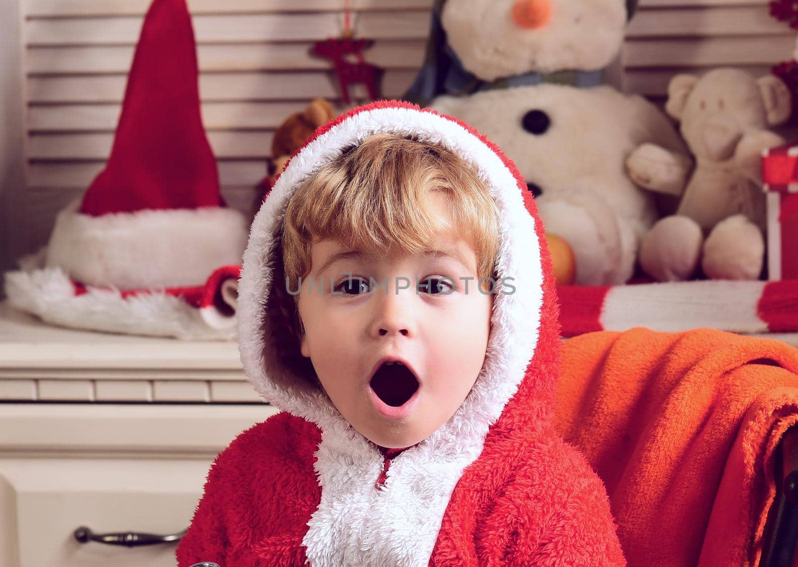 Excited Christmas for funny amazed child boy. Winter holiday, kids celebration new year, childhood.