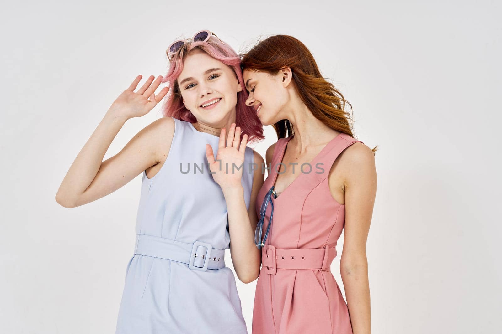 two women fashionable clothes posing accessories summer style. High quality photo