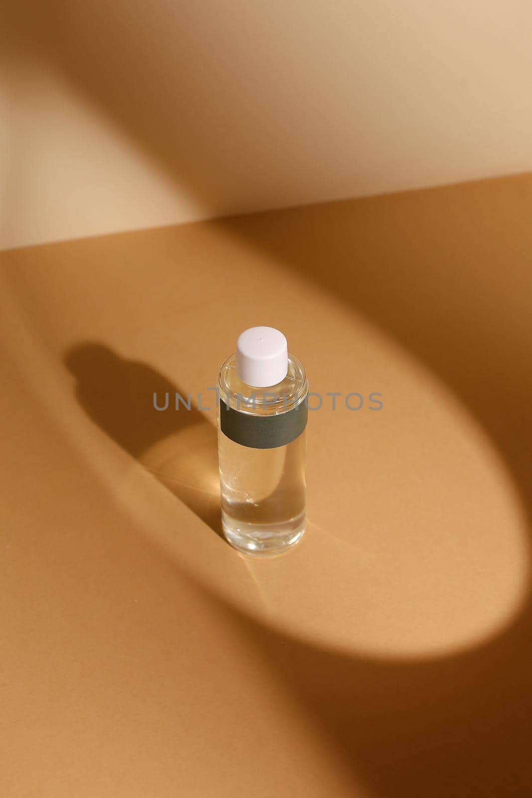 perfume bottle on the neutral modern background. perfect smell for her, woman present