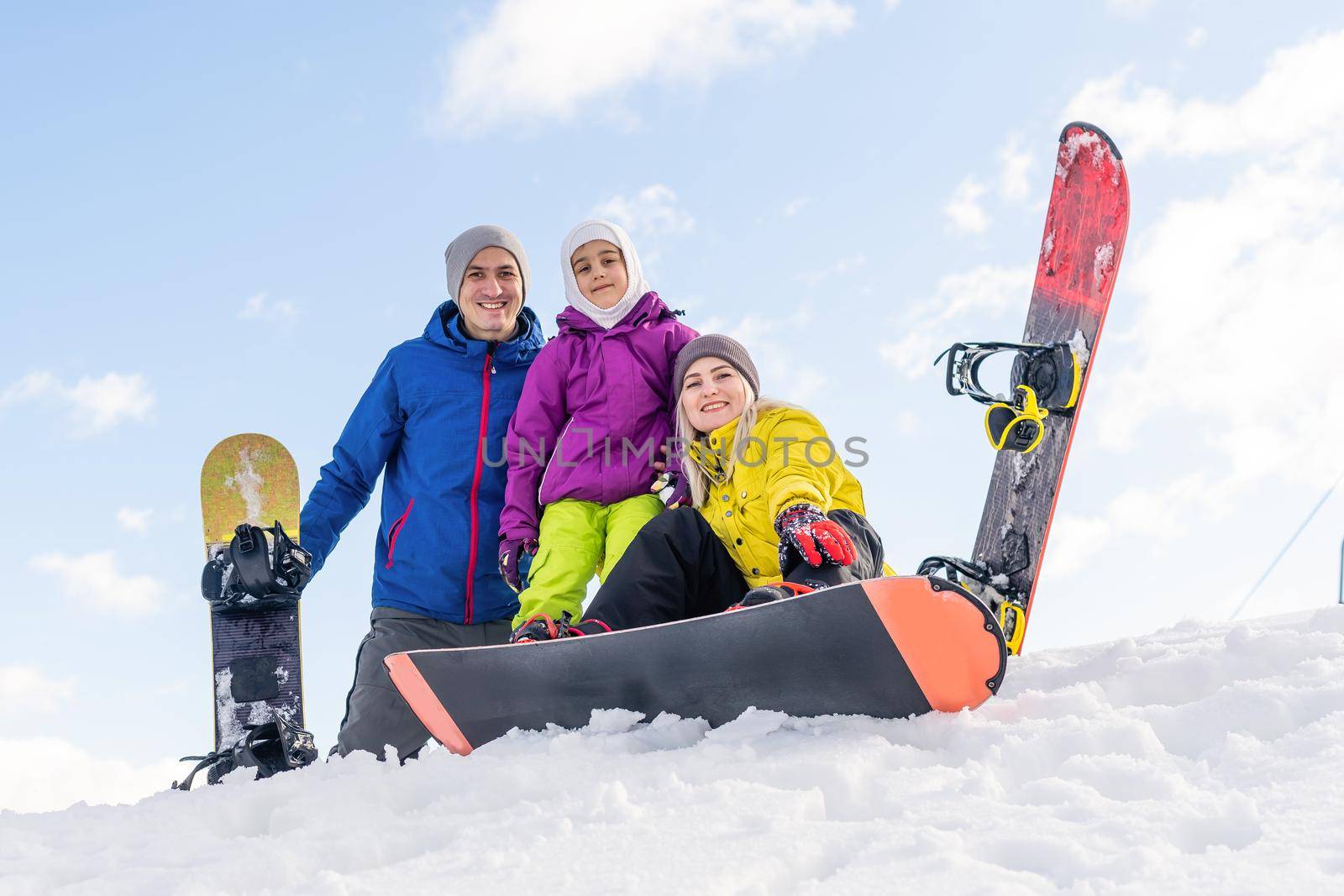 Winter,ski, snow and sun - family enjoying winter vacation by Andelov13