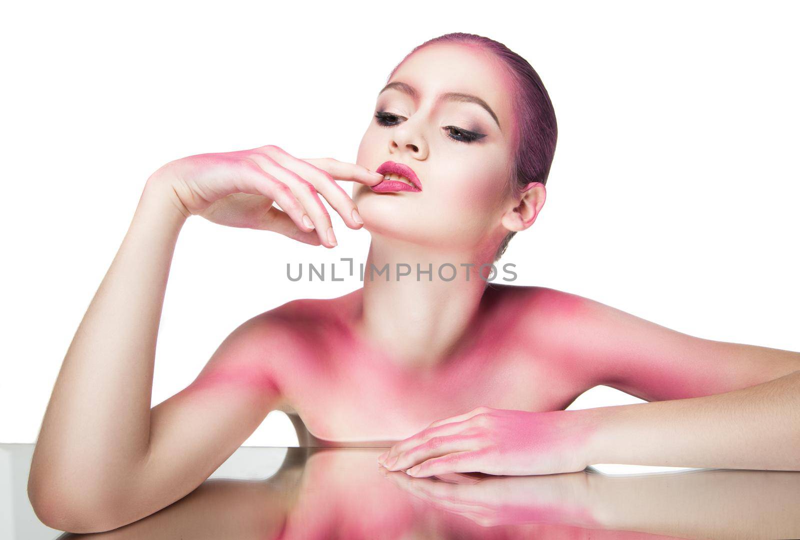 Portrait of young woman with make-up covered with bright pink glitter