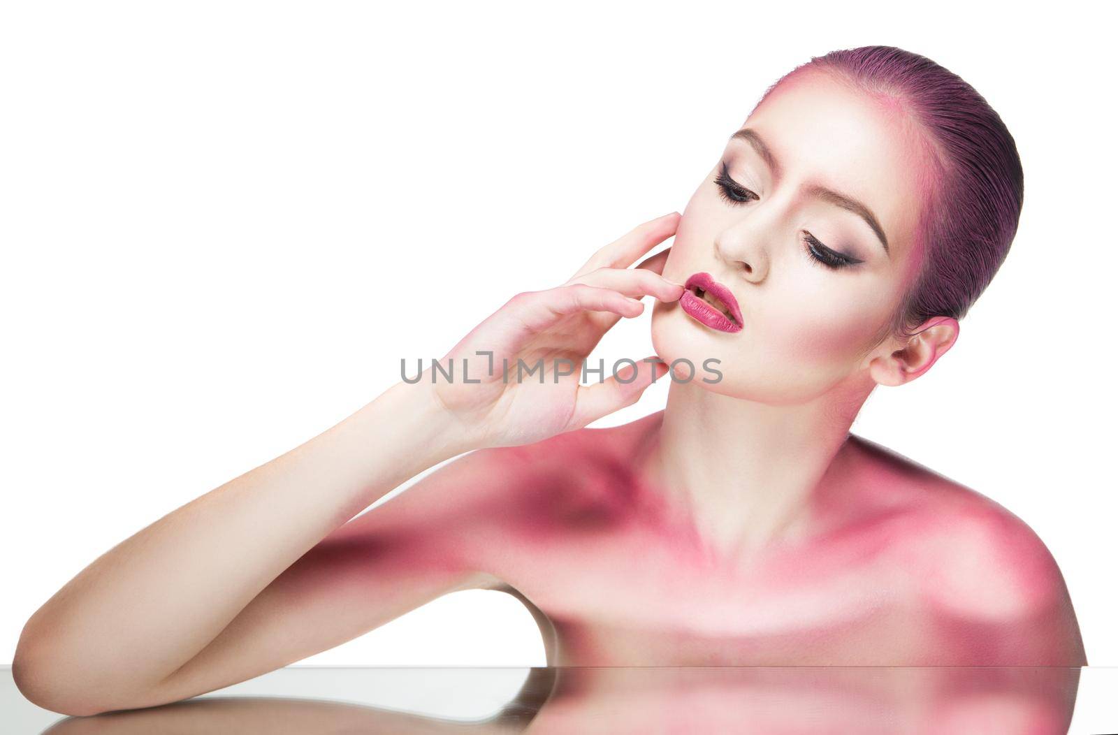Topless model with bare shoulders covered with pink glitter.Isolated