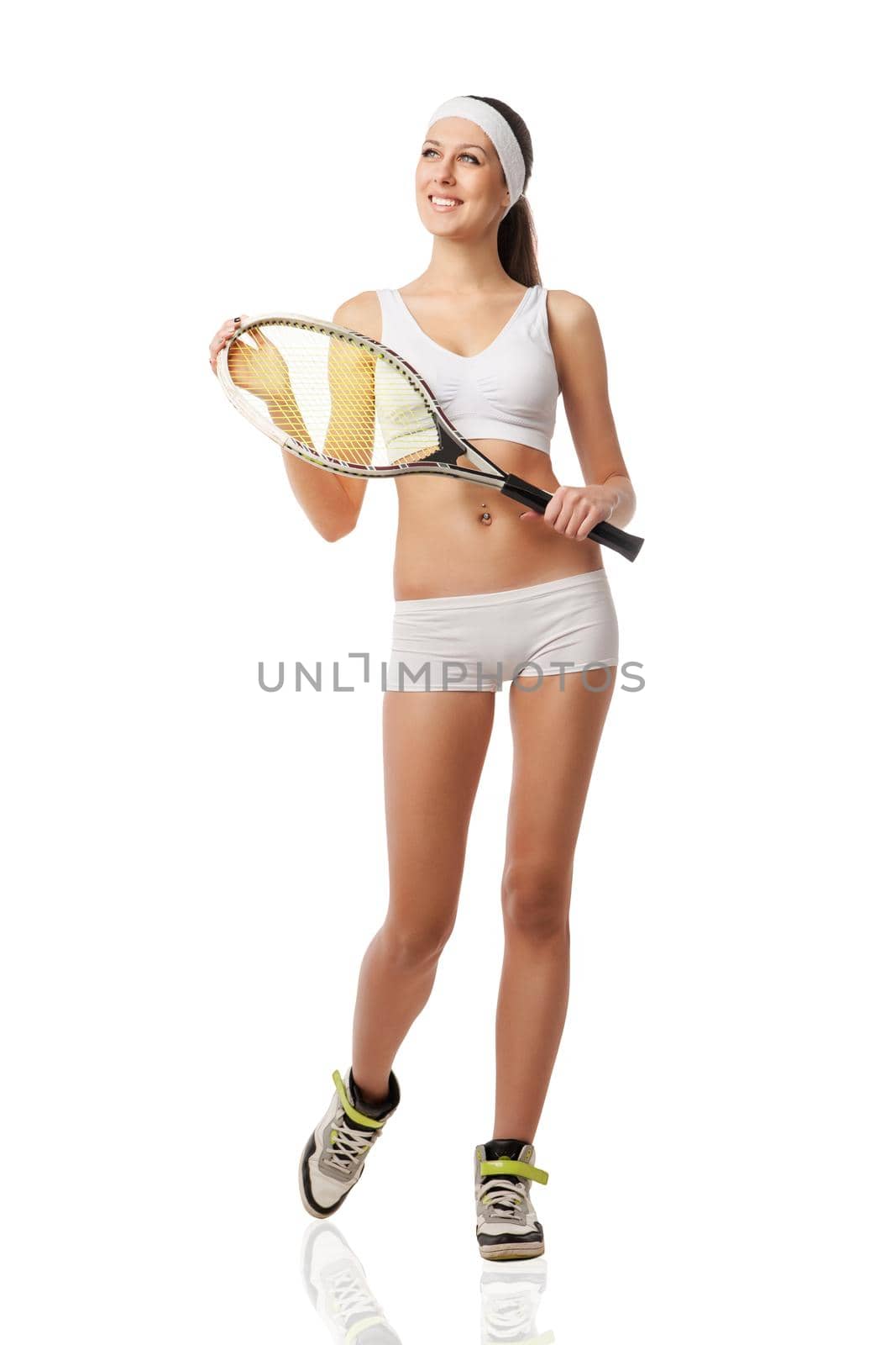 Adult woman holding a tennis racquet. Studio shot over white.