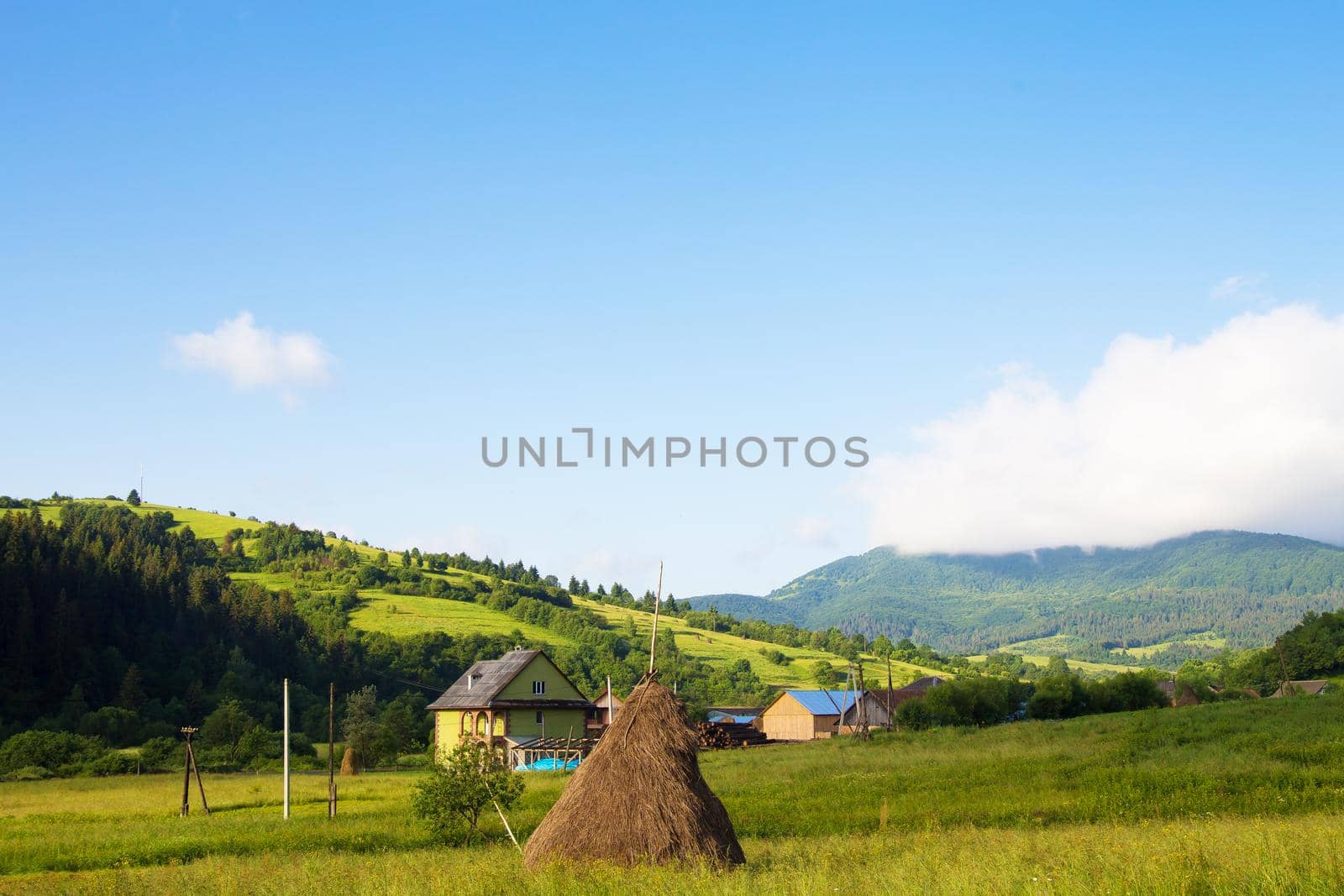 Haystack summer in the beautiful village Ukrainian Carpathians