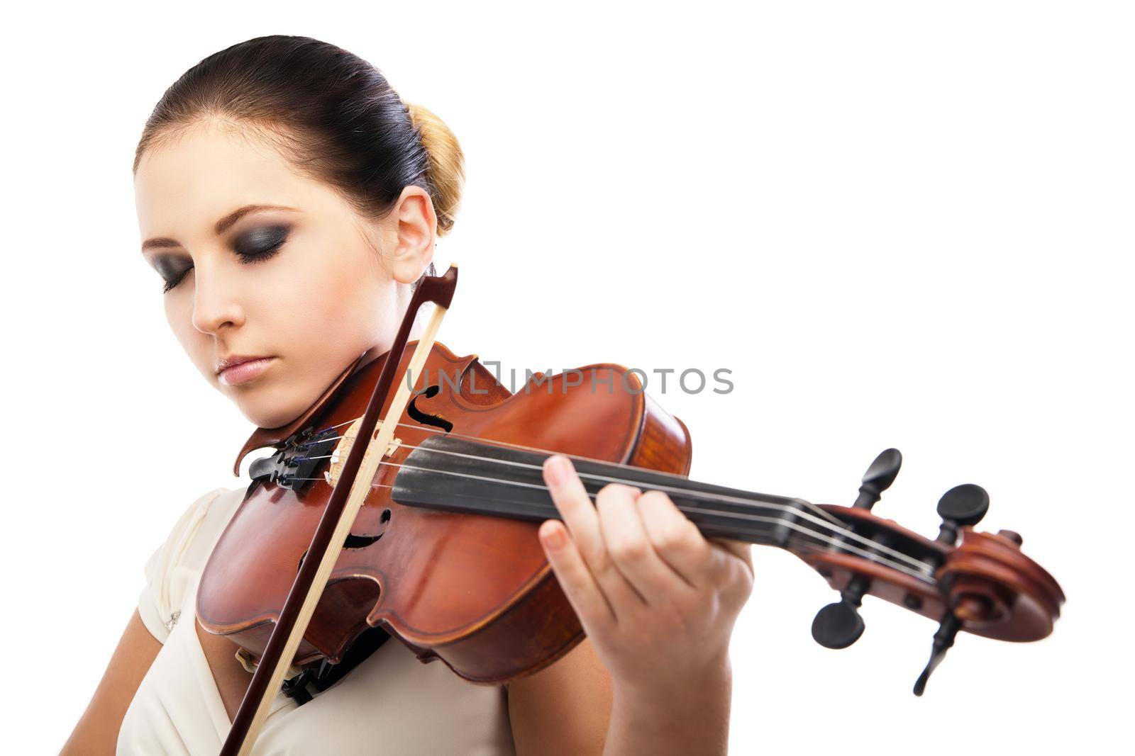 Beautiful young woman playing violin over white background