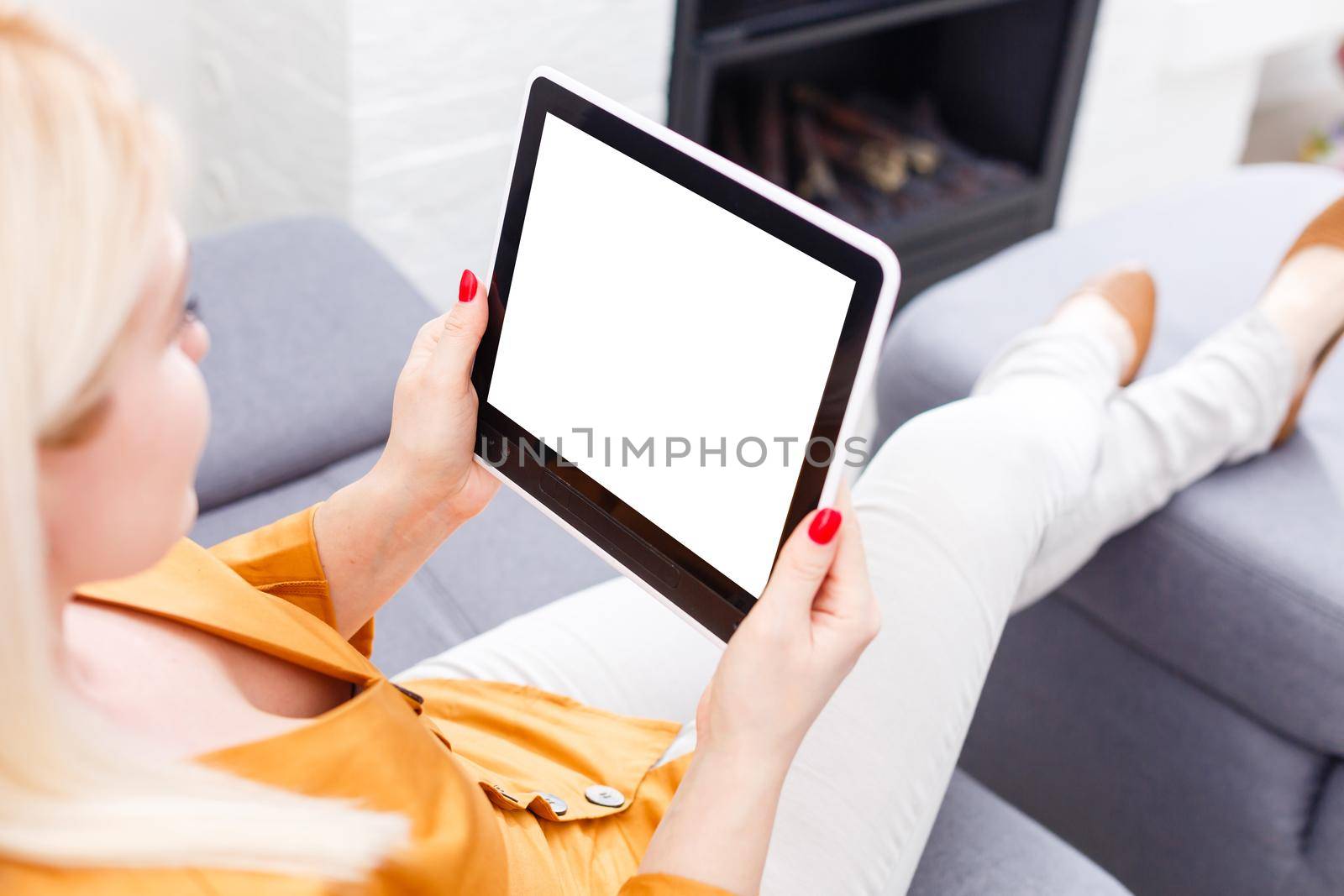 Business woman holding blank touch screen device.