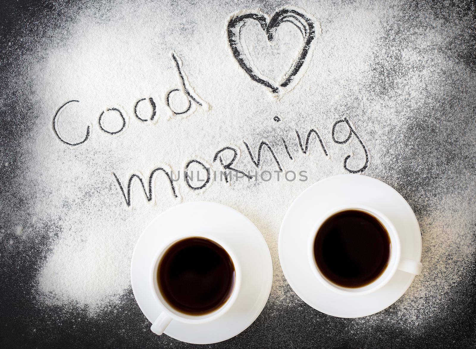 good morning inscription on the board with flour and two mugs of coffee. valentine card