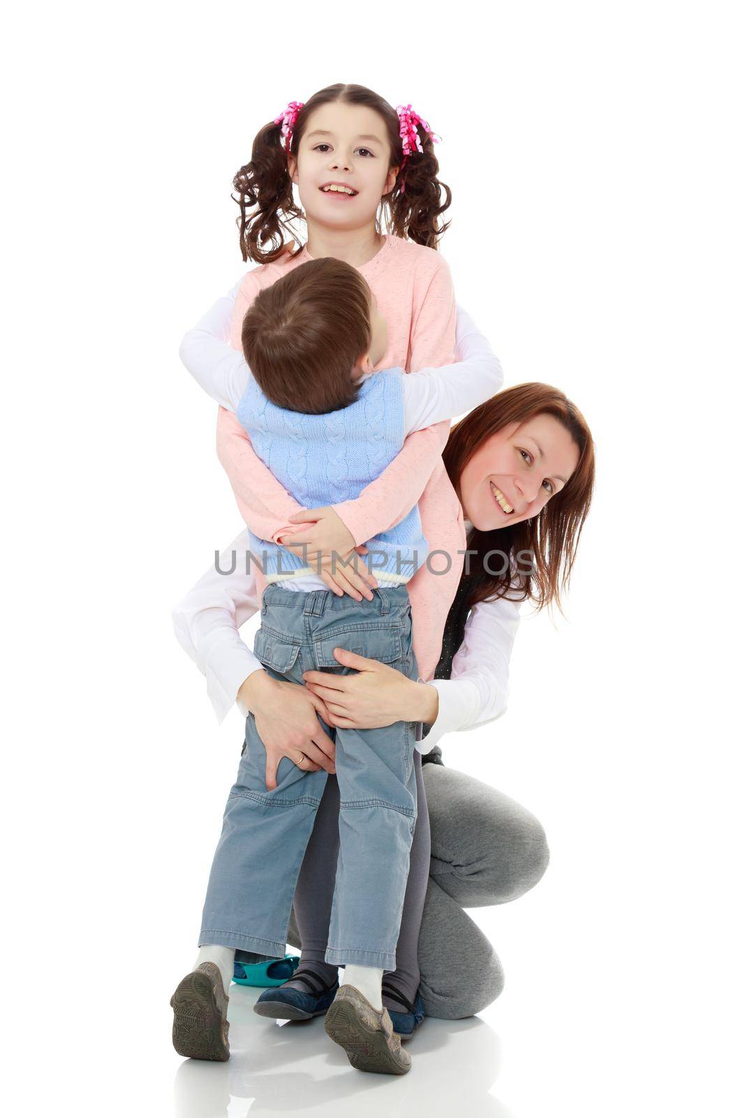 Happy mother hug her beloved children, daughter and son.Isolated on white background.