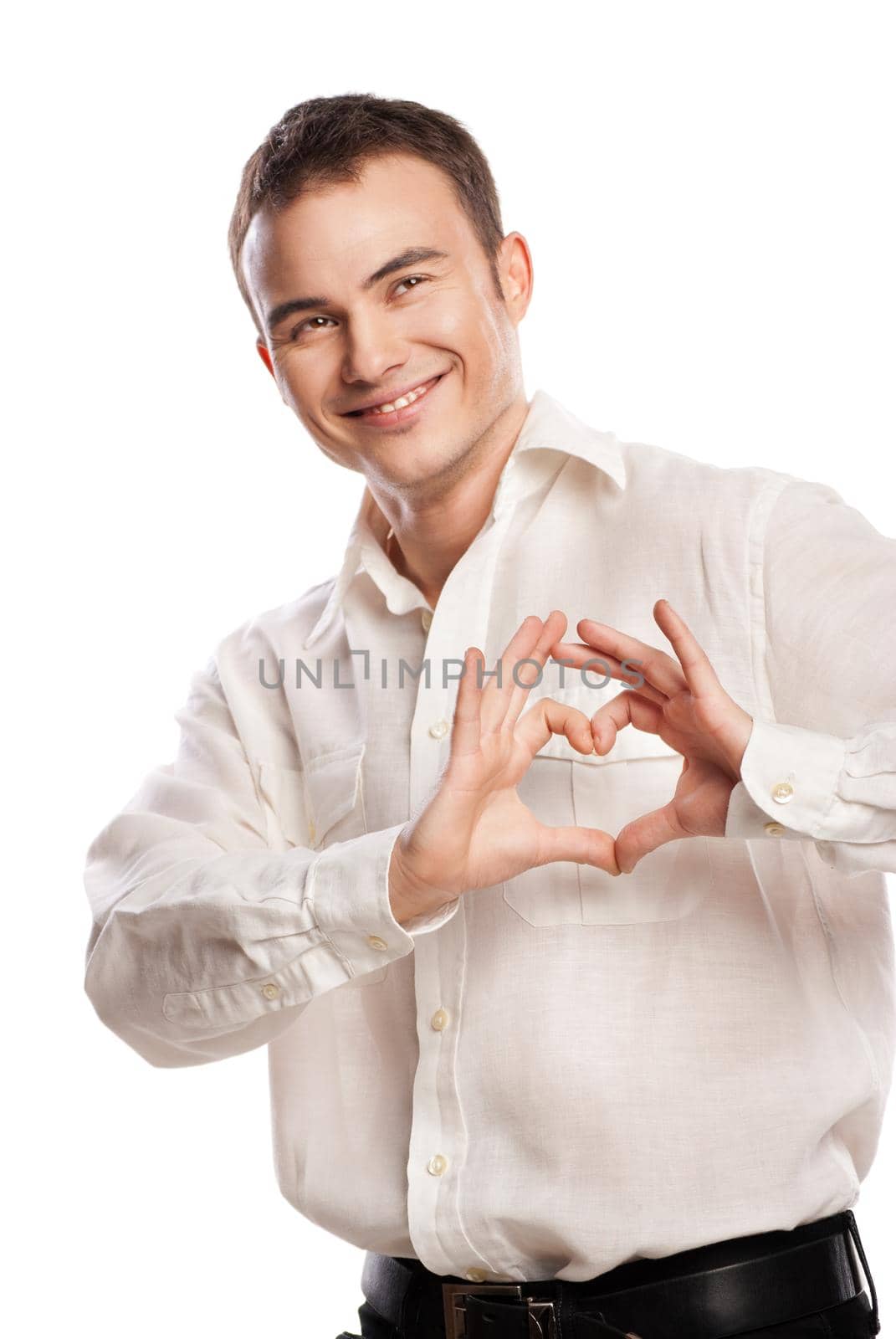 Portrait of happy man making heart from his hands on white background