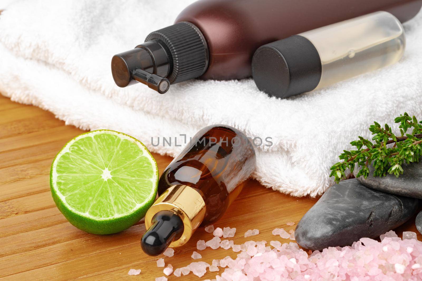 Beauty treatment items for spa procedures on wooden table, close up