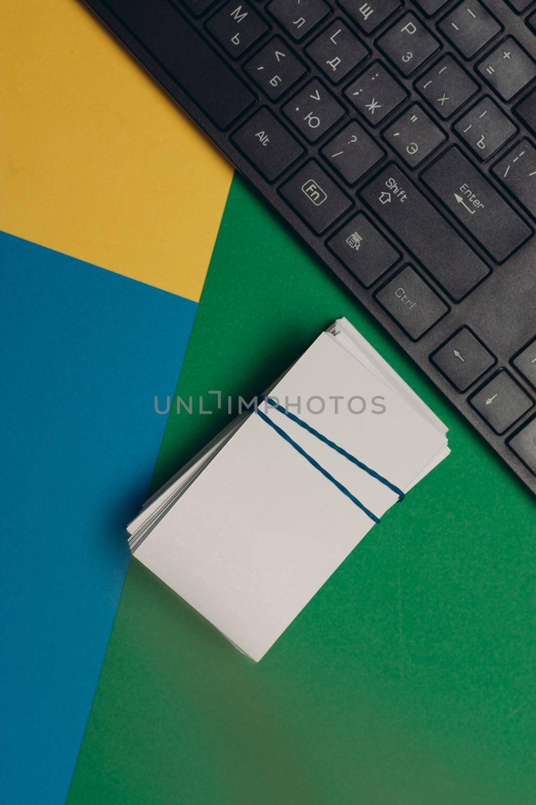 business cards in office supplies colorful background copy-space. High quality photo